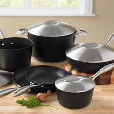 an assortment of pots and pans on a table