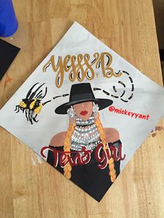 a decorated graduation cap with a woman's face on it and the words, year 8b