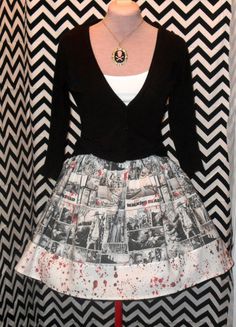 a dress is displayed on a mannequin with black and white chevron background