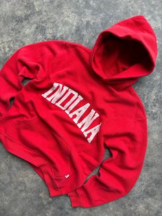 Vintage 90's Indiana University Russell Athletic Crewneck Sweatshirt Hoodie   Size Medium Measures 21" x 25" Great vintage shape Super soft & comfy  Any questions feel free to reach out! Red Hooded Sweatshirt With Embroidered Graphics, Red Hooded Hoodie With Embroidered Graphics, Red Embroidered Graphic Hoodie, Red Embroidered Hooded Hoodie, Casual Red Crew Hoodie, Casual Crew Neck Hoodie With Letter Embroidery, Casual Sweats With Embroidered Logo, Red Cotton Hoodie With Embroidered Graphics, Casual Crew Hoodie With Letter Embroidery