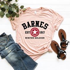 Barnes Est 1917 Shirt, Bucky Barnes Shirt,Barnes T-shirt, Winter Soldier Shirt, Avengers Shirt, Super Hero Shirt, Captain Shirt, Marvels Tee 🌺How to Order, -Swipe to all of the pictures -Select Size and Color of the Product from drop down menus -Select Quantity -Add your chart and place order -For every single shirt you have to repeat every step 🌺Material Info -Ultra Soft -Sideseamed -Retail fit -Unisex Sizing -Shoulder taping 🌺Processing Time info -Standart process time 1-3 days, for the rush options please directly send me message via ETSY 🌺Shipping Info USA Orders -First Class 4-6 days -Priority mail 3-4 days (sometimes 4-5 days, especially during holiday season, Halloween-Christmas) -Priority EXPRESS mail 1-2 days Canada, Standard 7-21 Days Priority International Mail 6-10 days Int Gilmore Girls T Shirt, Winter Soldier Shirt, Avengers Shirt, Super Hero Shirts, Shirts Streetwear, Science Shirts, Single Shirt, Limited Edition Shirt, Girls T Shirt