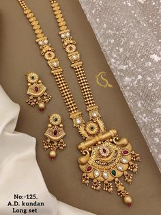 Description :- Wedding Long Necklace Sets - With Earrings Mother's Day gifts - Gift For Her - Neclace For Women - Minimalist Jewelry - Birthday Gift Gift yourself a royal look with this perfectly crafted kundan necklace set from Manalisstudio. Crafted with high quality kundan stones and pearls, it is impressive in design. The green enamel artwork adds perfect texture to the design. Perfect for weddings and festivities, this antique necklace set should be put on with your favorite sari or lehenga Long Gold Set Designs, Simple Gold Jewelry For Wedding, Temple Jewelry Sets With Matching Earrings For Gift, Temple Jewelry Sets With Dangle Shape As Gift, Elegant Jewelry With Simple Design For Valentine's Day, Intricate Dangle Jewelry For Anniversary, Temple Jewelry Dangle Sets For Gift, Temple Jewelry Set With Dangle As Gift, Anniversary Jewelry With Intricate Dangle Design