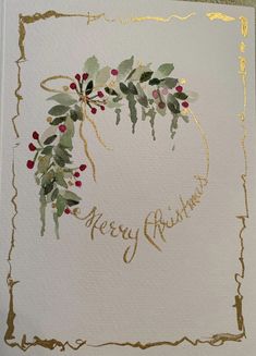 a christmas card with holly and berries on the front, gold foil lettering that says merry friday