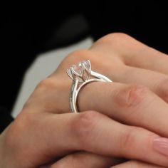 a woman's hand with a ring on it