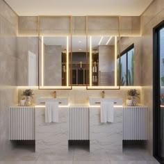 a bathroom with two sinks, mirrors and lights on the wall above it's windows