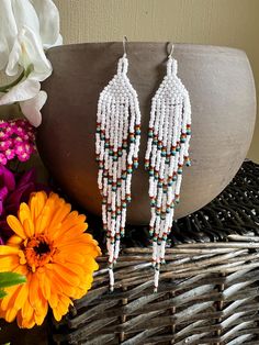 Beaded Fringe Earrings in white, dark red, pumpkin, turquoise, and dark emerald green. Handmade with glass beads, silk thread, and sterling silver hooks. Beaded Fringe Earrings Pattern, White Fringe Earrings, Fringe Earrings Pattern, Fringe Earrings Diy, Red Pumpkin, Rainbow Feather, Native Earrings, Dark Emerald Green, Native American Beadwork Patterns