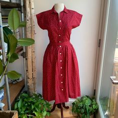 Rare To Find Vintage Laura Ashley (Est. 1980’s) Midi Length 50’s Style Dress. Features A Mini White Star Pattern On Red Background. Matching Sash Belt. Excellent Vintage Condition Note Small Faint Stain @Bottom Hem ~.25”X.5” (Otherwise Looks Brand New) Button Up Hand Side Pockets Collar Short Sleeve 100% Cotton Pearlescent Shell Buttons Original Extra Button Included Size 8 ~ Measurements Taken Flat, X2 Where Needed: 17” Pit To Pit 8” Sleeve Opening 15” Waist 45” Long Style Emulated By: Christy Red Fitted Vintage Summer Dress, Fitted Red Vintage Summer Dress, Fitted Red Vintage Dress For Summer, Retro Red Knee-length Midi Dress, Red Retro Knee-length Midi Dress, Red Vintage Fitted Dress With Short Sleeves, Vintage Red Short Sleeve Dress, Red Retro Vintage Dress For Spring, Retro Red Lined Dress