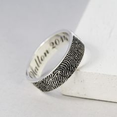 a fingerprint ring with the word willown 2012 engraved on it's side