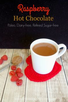 raspberry hot chocolate in a white mug on a red coaster