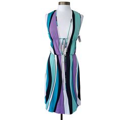 New With Tag (With Flaw) Moschino Cheap & Chic Plunge Neck Mini Dress Size 8 Us Msrp $458 Retro Groovy Wavy Stripe Print In Shades Of Purple, Mint, Turquoise, Black & White Plunging To The Waist V Neckline With A Drawstring Tie Below The Bust A-Line Skirt Below The Knee Length (On Me 5'4) Elastic Waist Unlined Rayon Jersey Knit With Some Stretch Made In Italy New With Tag; There Is A Spot On The Back With A Faint Watermark Around It. I Have Not Dry Cleaned To Remove Since It Is New With Tag. App Cheap White Stretch Midi Dress, Cheap Stretch White Midi Dress, Cheap Stretch Mini Skirt With Drawstring, Cheap Retro Knee-length Mini Dress, Dresses For The Races, Graphic Print Dress, Moschino Dress, Moschino Couture, Moschino Cheap And Chic