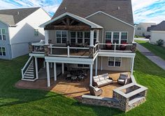 an aerial view of a house with patio and deck