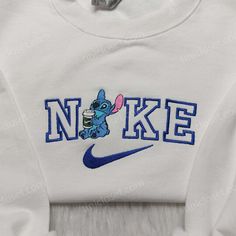 Stitch Nike Embroidered Shirt, Nike Inspired Embroidered Shirt, Disney Family Shirts Pull Nike Stitch, Disney Nike Crewneck, Stitch Nike Sweatshirt, Nike Disney Sweatshirt, Disney Embroidered Long Sleeve Tops, Disney Style Embroidered Long Sleeve Tops, Disney Embroidered Crew Neck Tops, Disney Cotton Top With Embroidered Logo, Disney Cotton Tops With Embroidered Graphics