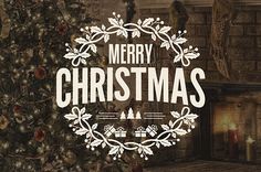 a christmas card with the words merry christmas written in front of a fireplace and decorated tree