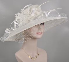 White Brimmed Headpiece For Wedding, White Brimmed Wedding Headpiece, White Flat Brim Hat For Wedding, Elegant Brimmed Wedding Hat, Elegant White Flat Brim Costume Hat, Elegant Brimmed Hat For Weddings, White Elegant Flat Brim Costume Hat, Elegant Cream Fascinator With High Crown, Elegant Top Hat For Royal Ascot Wedding