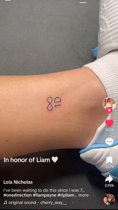 a person with a small tattoo on their arm that says in honor of llama