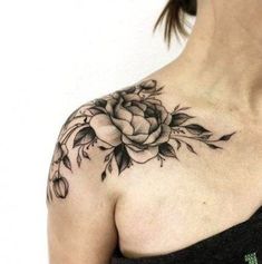 a woman with a flower tattoo on her chest