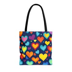 Indulge in the epitome of girly charm with our exclusive Girly Heart Tote Bag, featuring a delightful array of yellow, orange, purple, pink, red, and green small and big hearts. This trendy and spacious tote is the perfect accessory to add a pop of vibrant colors to your ensemble. Crafted with love and attention to detail, this stylish bag is not only a fashion statement but also a practical choice for carrying your essentials. Elevate your fashion game and showcase your feminine flair with this must-have girly heart tote that effortlessly combines functionality with playful aesthetics. Shop now to embrace the joy of carrying a bag as unique and colorful as you are! This practical, high-quality Tote Bag is available in three sizes (Small, Medium, and Large), and includes the following: * 1 Heart Tote Bag, Girly Bags, Big Heart, Stylish Bag, Perfect Gift For Her, Fashion Games, Black Cotton, Reusable Tote, Reusable Tote Bags