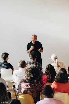 a man standing in front of a group of people