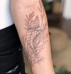 a person with a tattoo on their arm