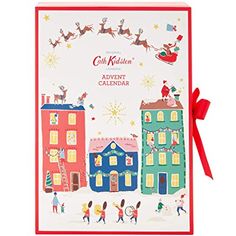 a christmas card with santa's sleigh flying over town