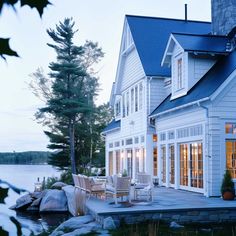 a large house sitting next to a body of water