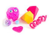 an assortment of toys including a pink toy