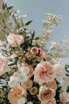 a bunch of flowers that are sitting on a table