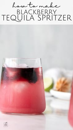 a close up of a drink in a glass on a table with the words how to make black berry tequila spritzer