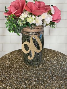 a vase filled with flowers sitting on top of a table