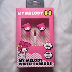 two hello kitty earbuds in a pink package on a white bed with the words, my melody