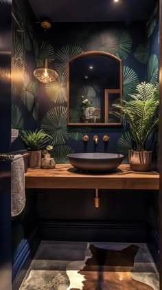 a bathroom with a sink, mirror and plants