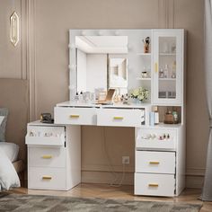 a white desk with drawers and a mirror on it in a bedroom next to a bed