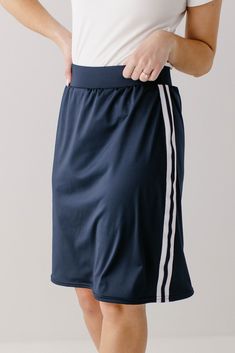 Looking for modest options to accompany your active lifestyle? We have you covered with our modest athletic skort! Our high quality, athletic skorts are cut and sewn right here in Lancaster County, Pennsylvania and have withstood even the most rigorous activities. With fitted knee length shorts sewn in at the elastic waistband, this skort will soon become your go to piece for your favorite sport or activity! Choose from several shades and stripe or no stripe! Made with a moisture-resistant, medi Short Sew In, Modest Plus Size, Dark Grey Skirt, Exercise Clothing, Modest Girl, White Skort, Athletic Skort, Knee Length Shorts, Casual Athletic