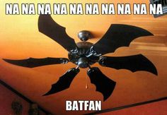 a ceiling fan with the words batman painted on it