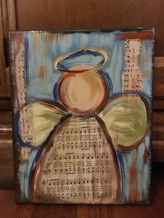 an angel with musical notes painted on it