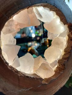 the inside of a piece of wood with ice crystals in it's center hole