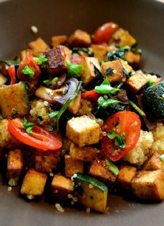 a plate with tofu and vegetables on it