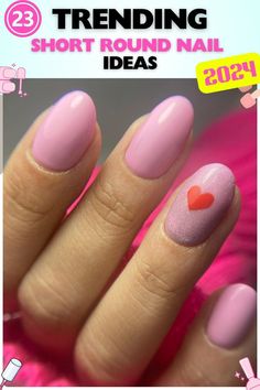 Pink short round nails with a heart accent, gel polish, sweet and creative, perfect for romantic occasions or adding a touch of love to your day, featuring a glossy finish. Nails With A Heart, A Heart