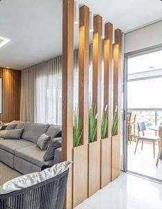 a living room filled with furniture next to a sliding glass door