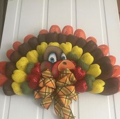 This is a cute turkey wreath that is 22"wx18" long. It has got colorful feathers on the turkey, and has a painted turkey head .  This turkey wreath is ready to be shipped. This weath can be hung inside your home or outside under a covered area, to protect it from bad weather.  Thank you for stopping by and checking my shop -Rosekrans Creation. If you could favorite my shop it would be greatly appreciated and you will get notified when I list new items in my shop. Turkey Wreaths, Painted Turkey, Turkey Head, Turkey Wreath, Fall Door Hanger, Cute Turkey, Door Hanger Wreath, Hanger Wreath, Fall Door Hangers