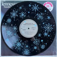 an old record with snowflakes on it