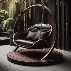 a black chair sitting on top of a wooden swing