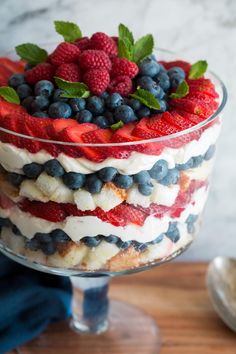 a trifle with strawberries, blueberries, and raspberries in it