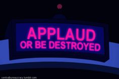 a neon sign that says applaud or be destroyed