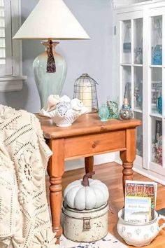 Discover how you can add a touch of coastal elegance to your farmhouse-style home with these seashell decor ideas. Whether it's creating DIY seashell wall art or incorporating natural elements into your table settings, these inspiring suggestions will breathe new life into your living space. Embrace the serenity of the sea right in your own home! Dark Wood Shelves, Teal Lamp, White Marble Sink, Shell Centerpieces, Boho Dining Room