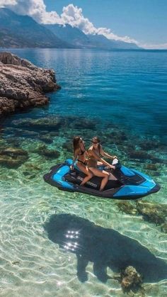 two people on a jet ski in the water