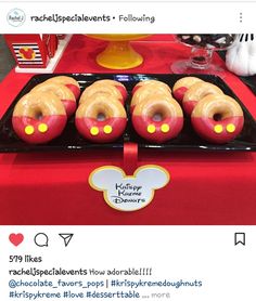 mickey mouse doughnuts are on display at the table