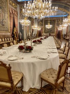 a large dining room set up for a formal dinner