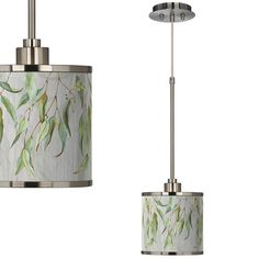 two light fixtures with green leaves on them