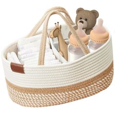 a basket with baby items in it and a teddy bear